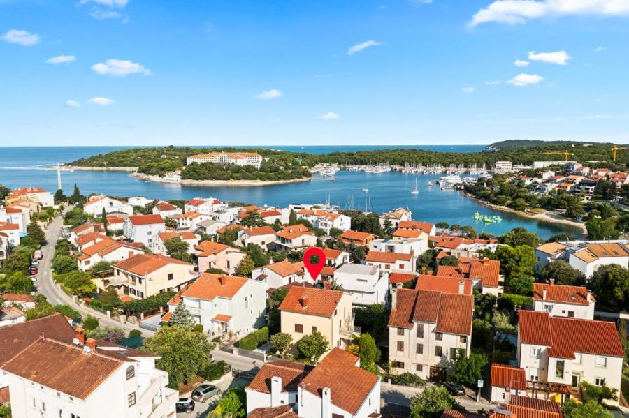 Our house, marked with a pin, and the bay of Pješčana Uvala from above
